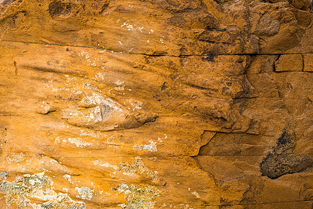 山河河床的含层岩表表 以及沉积层压溪流砂岩橙子石头银行薄片碎屑材料图片
