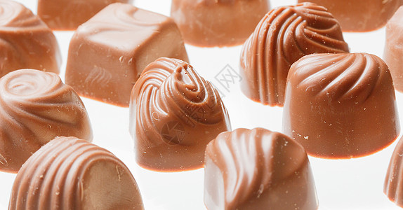 巧克力甜甜糖特写紧身裤盒装纯牛奶糖果甜点食品食物口粮烹饪蛴螬背景图片