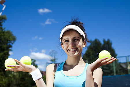 妇女打网球 自然色彩多彩的音调网球体育游戏生活休闲器材女士训练闲暇用品图片