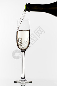 香槟泼洒瓶子高脚杯运动白色长笛气泡水晶庆典酒精图片