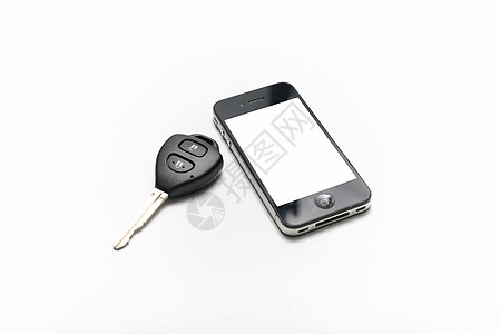 有智能电话的车用钥匙展示引擎手机木头屏幕口袋技术桌子图片