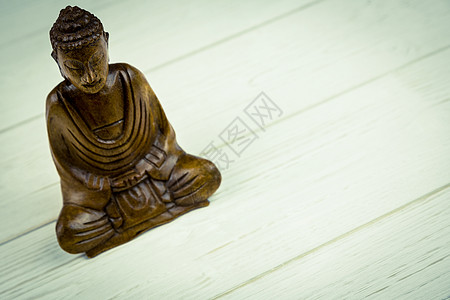 桌子上的佛像沉思雕像雕塑信仰塑像冥想宗教背景图片