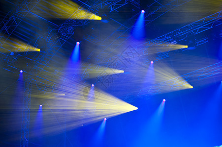 灯光表演激光聚光灯蓝色居住黄色舞台设备头灯音乐会展示背景图片