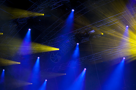 灯光表演音乐会展示聚光灯蓝色设备激光舞台黄色头灯居住背景图片