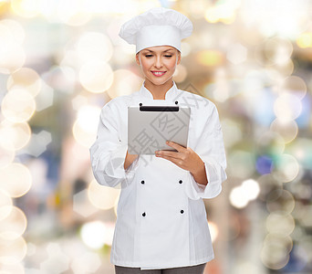 配有平板电脑的笑着女厨师服务女孩女士女性工作餐厅职业管理人员技术美食图片