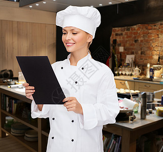 带黑白纸 微笑着的女厨师厨房帽子职业快乐美食女孩女士工作女性食物图片
