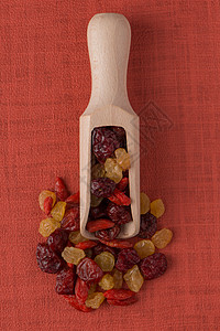 含干果的木制勺子水果小吃饮食橙子团体工作室棕色红色宏观食物图片