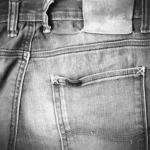 Jean裤子上的标签 黑白音调颜色样式服装贴纸皮革框架织物服饰纺织品接缝牛仔布黄色图片