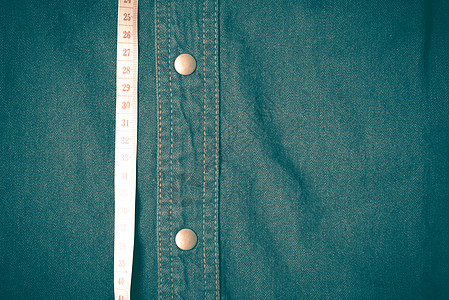Time 磁带和 Jean 纹理回写风格节食厘米衣服纺织品裤子织物黄色蓝色统治者腰部图片