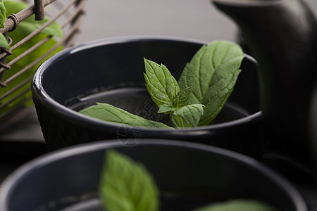 薄茶早餐杯子草本药品饮料茶碗绿色叶子玻璃白色图片