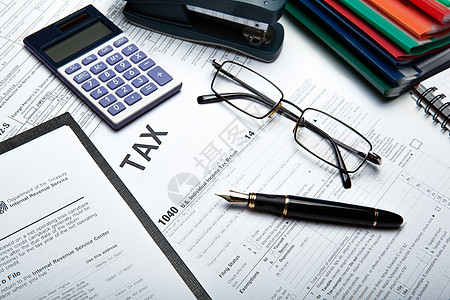 桌面上的填充税务回报静物征收立法预算粪便工作计算器贡献职业退税图片