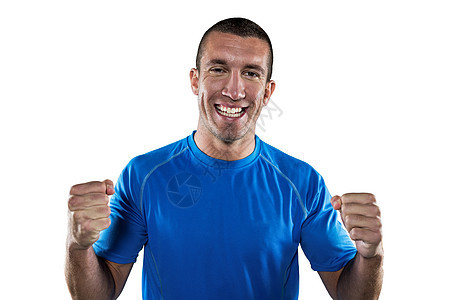 快乐橄榄球运动员的肖像拳头运动成就男性胜利挑战蓝色欢呼球衣服装剪下高清图片素材