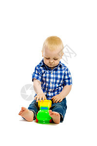玩玩具的婴儿男孩乐趣童年男性孩子们塑料白色孩子儿童金发地面图片