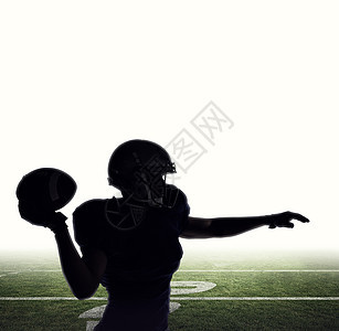 美国橄榄球运动员抛球的轮光图像合成图象Name体育灰色插图混血男人垫肩沥青团队竞技足球图片
