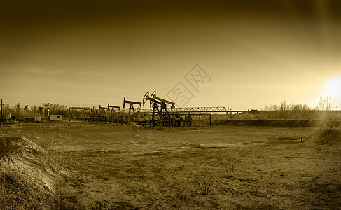 海上油田油田上的油泵矿业工业机械千斤顶棕褐色钻孔用地化石油井调子背景