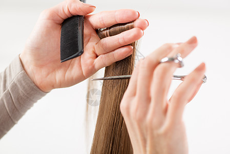 剪头发护理工具梳理发型水平理发人类工作棕色梳子背景图片