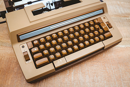 旧打字机视图键盘沟通木头风格静物桌子工具打字机书写复古背景图片