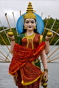 女印度教教徒的木雕像套装金子切口卷曲花瓶裙子历史祷告蓝色艺术图片