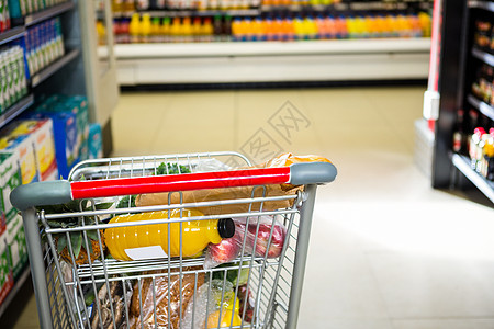 装满的购物车视图市场饮食产品零售大车顾客杂货店走道架子商业图片