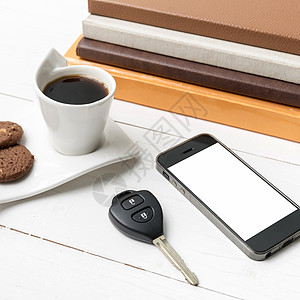 咖啡杯加饼干 手机 车钥匙和书本桌子办公室细胞工作网络咖啡眼镜电话笔记本杯子图片