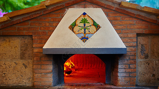 传统烹饪炉烧伤食物壁炉煤炭厨房石头余烬火焰火炉面包图片