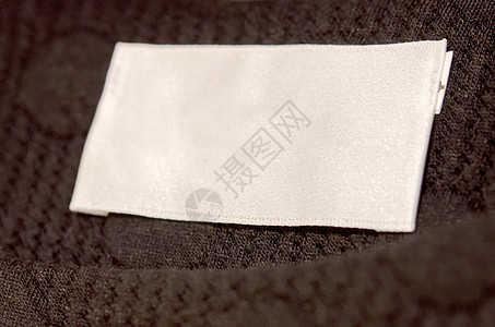 徽章项圈洗涤白色规格标签织物宏观材料衣服鉴别衬衫背景图片