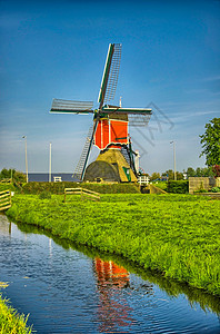 荷兰或荷兰的Kinderdijk风车和水渠磨坊历史性地标反射力量活力堤防风景农村场地图片