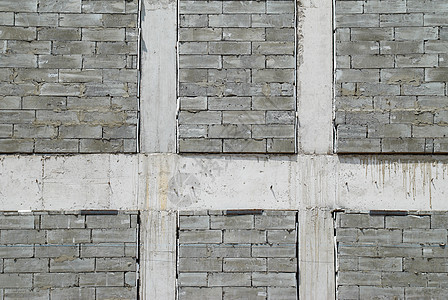一堵磨灰色建筑砖墙风化材料力量路障边界历史长方形历史性城市石墙图片