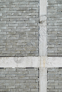 一堵磨灰色建筑砖墙历史生活材料黏土城市边界岩石路障历史性石墙图片