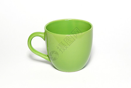 以白色隔离的绿色茶杯图片