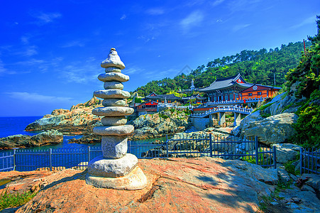 寺和南朝鲜釜山海云台海海石头建筑学地标纪念碑旅行游客海洋佛教徒云台吸引力图片