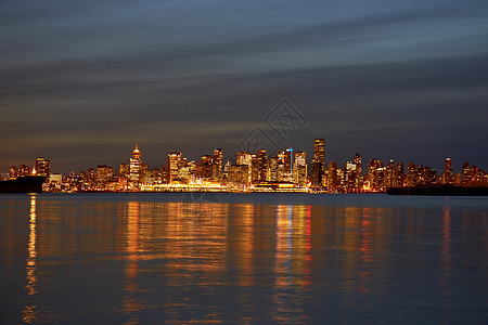 夜间城市天空旅游市中心海洋反射场景日落港口建筑学旅行图片