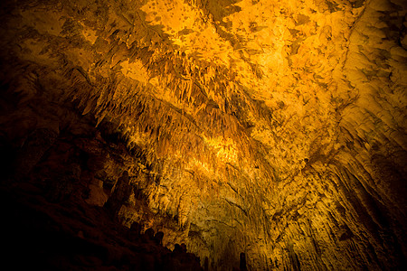 洞穴中的定线太阳隧道入口石头阴影地标岩石石灰石勘探旅游图片