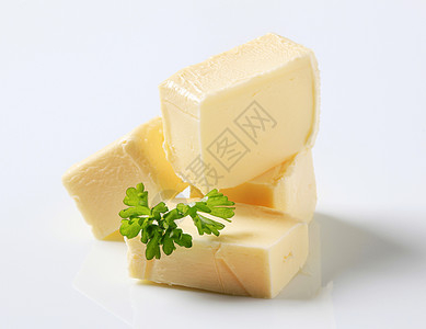 黄油块块香菜积木奶制品食品背景图片