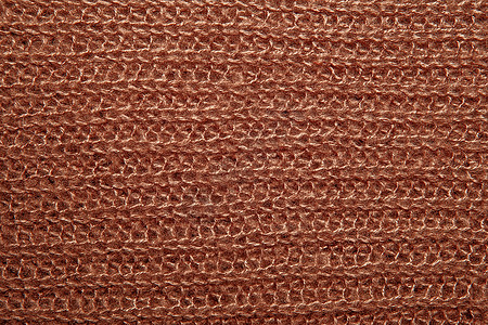作为背景的棕色蓬松被编织的螺纹毛线衣织物衣服火花装饰风格制造商打印纺织品材料羊毛图片