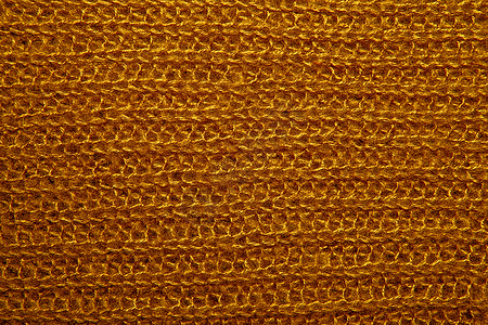 作为背景的棕色蓬松被编织的螺纹毛线衣羊毛纺织品打印橙子球衣制造商毛衣材料制造业手工图片