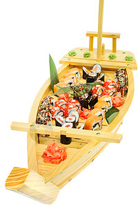 寿司船船形板板上一套寿司胶卷海鲜盘子奶油食物白盘子团体美食船模套餐鳗鱼背景