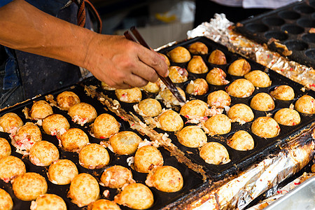 鱿鱼球烹饪红烧章鱼街道饺子海鲜食物圆圈餐具面粉图片