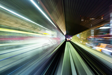 在隧道中快速行进的火车运动旅行通勤者车辆过境技术场景运输速度铁路背景图片