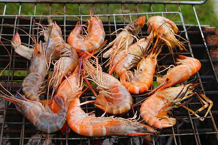 烧烤炉上的虾子火焰营养派对美食红色食物烧烤熏制贝类烹饪图片