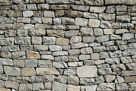 堆叠的石墙纹理石头砖墙石膏历史建筑灰色水泥棕色材料图片