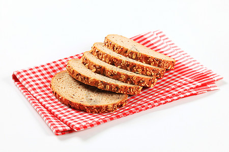 切片面包亚麻餐巾检查茶巾食物红色谷物种子图片