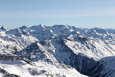 瑞士阿尔卑斯山冬季山区岩石单板首脑风景顶峰冰川蓝色滑雪胜地天空背景