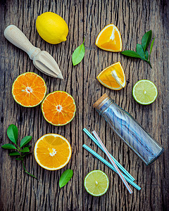 混合新鲜柑橘鲜果和橙叶背景的混凝土饮食情调液体橙子热情果汁营养柚子薄荷食物图片