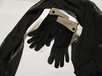 黑色围巾和手套背景图片