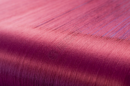 一家纺织厂织物机的折叠圈上的绿丝绸棉线翘曲工厂布料背景控制纤维工业牙线团体图片