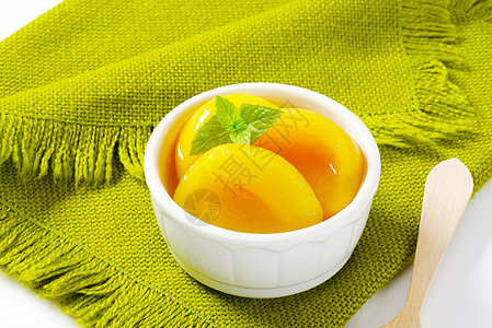 罐头桃子一半罐装甜点餐垫水果白色绿色食物小吃糖浆图片