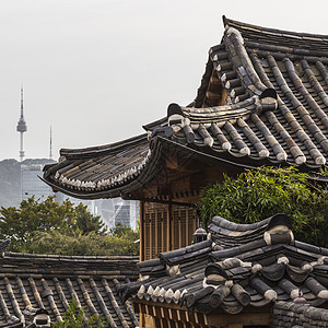 北村韩屋村村是韩国三角车的著名地点之一建筑物地标历史性街道房子市中心住宅旅行女性游客背景