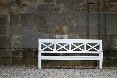 白凳长椅石头鹅卵石砂石背景图片