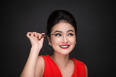 化妆和化妆品概念 亚洲女性做化妆眼罩女士推杆女孩眼影皮肤黑色白色刷子眼睛睫毛图片
